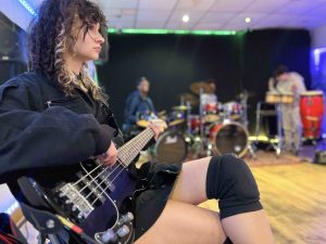 Jazz - Teen girl Sabina practices bass guitar at CultureMix Centre